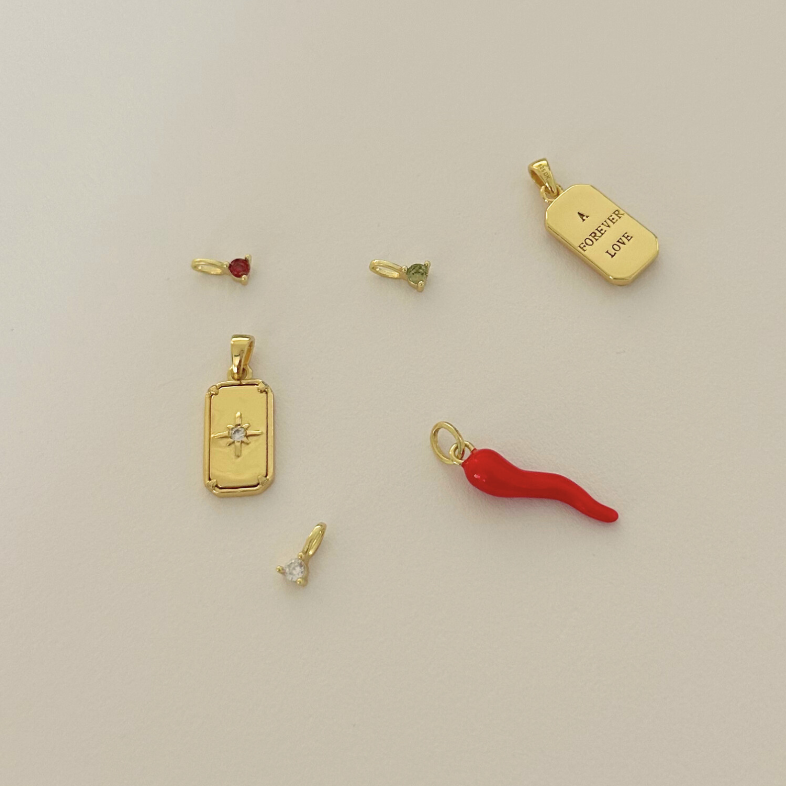 Charm Your Way - Unveiling Our New Collection Of Birthstones, Initials, and Protective Talismans