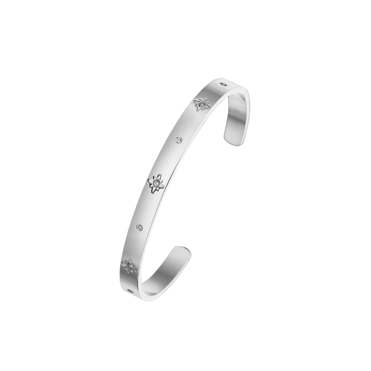 A stainless steel cuff bangle bracelet with round white cubic zirconia set stones delicately placed around the cuff.