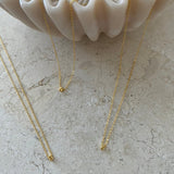 14K solid gold petite initial necklace with a delicate chain