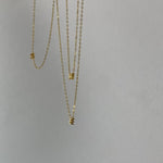 Close up gold vermeil initial necklaces