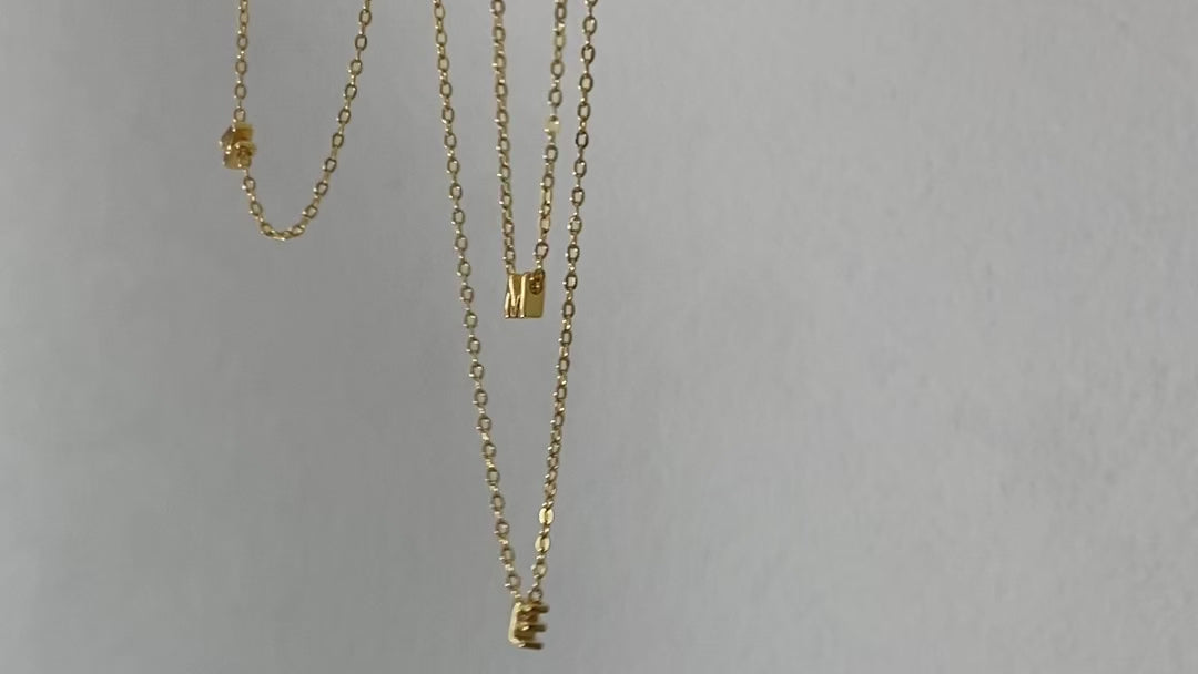 Close up gold vermeil initial necklaces