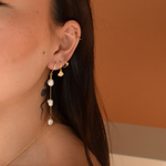 Detail of Ivory Pearl Earrings - 14K Gold Plated being worn with a coordinating outfit