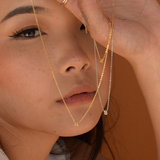 Model displaying vermeil and sterling silver petite initial necklaces
