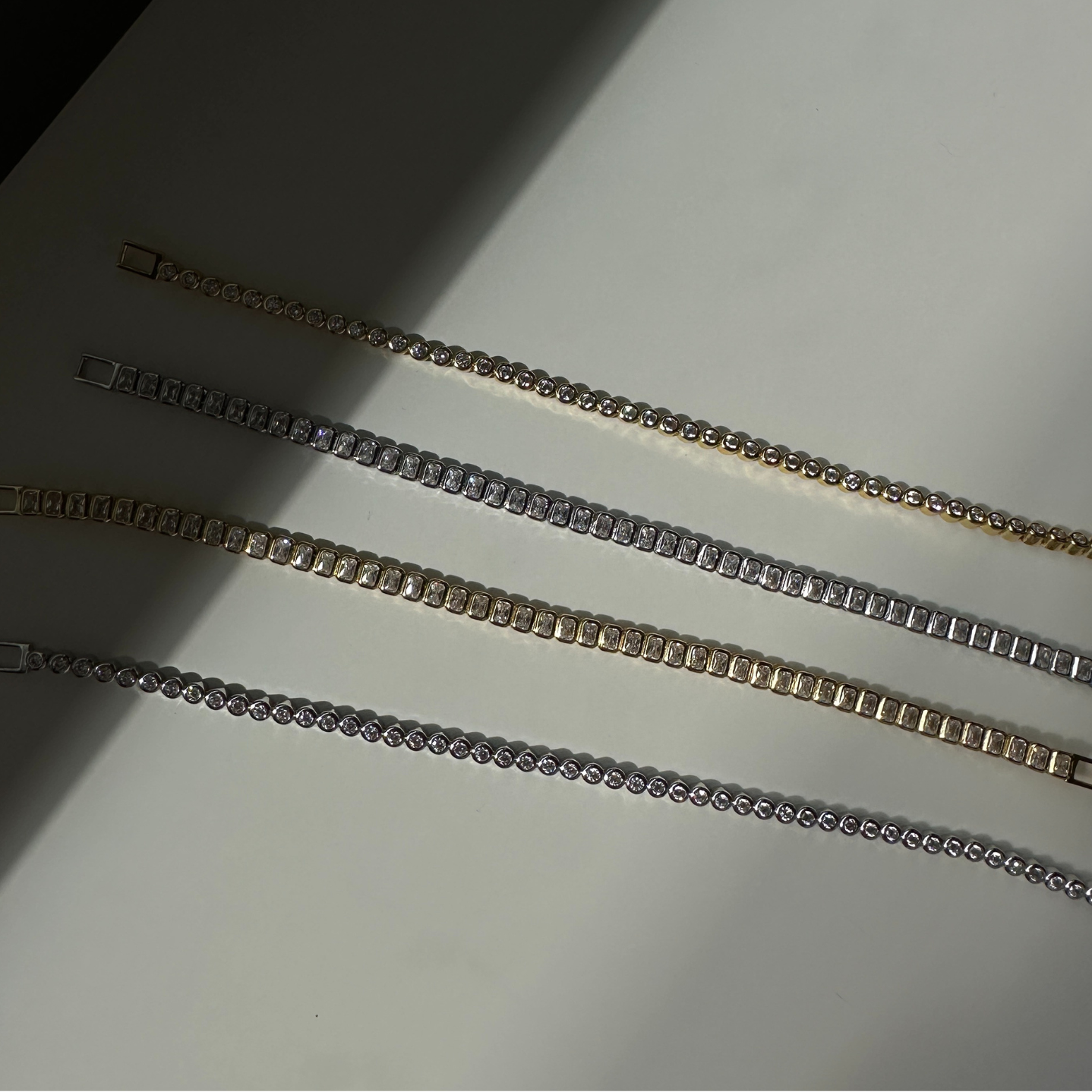 Close-up of a sterling silver baguette tennis bracelet showcasing its design