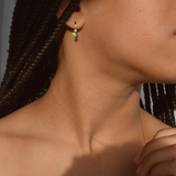 Profile view of a woman adorned with 14K gold-plated Lila Hoops earrings