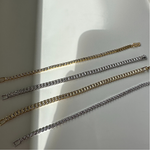 14K gold plated tennis bracelet with round-cut stones displayed on a white background