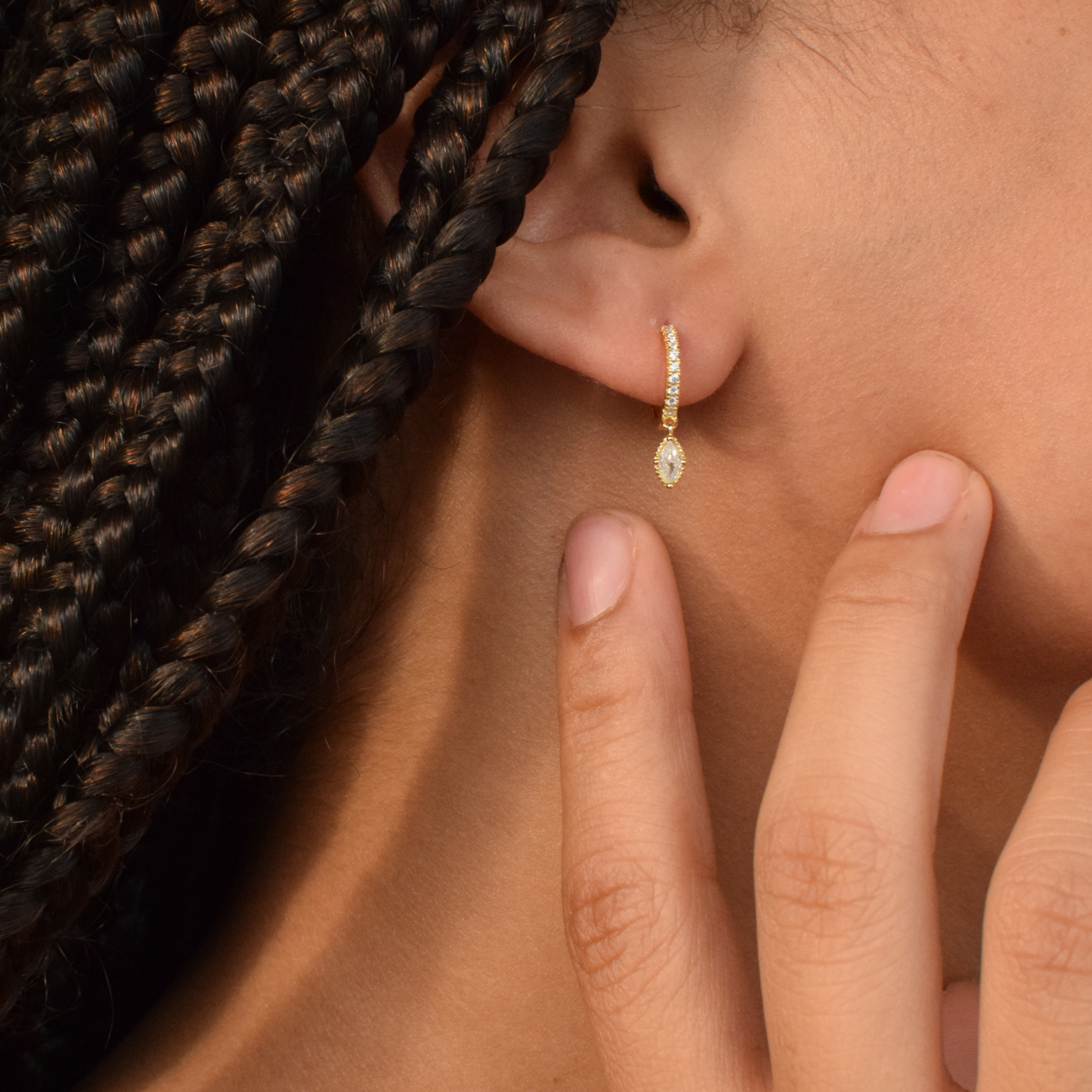 Close-up of a woman wearing the 14K Gold Plated Lola Hoop earrings