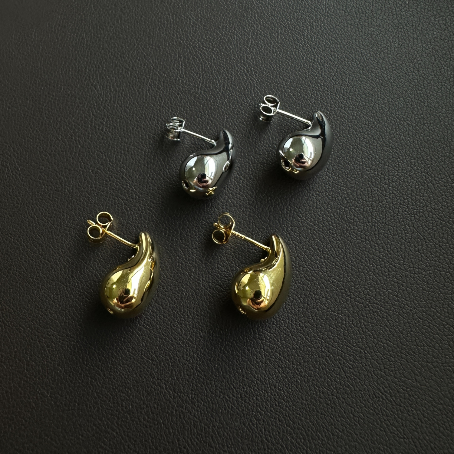Close-up of sterling silver teardrop stud earrings