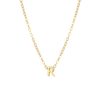 Close-up of a 14K solid gold necklace with the initial 'R' pendant