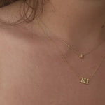 Close-up of the 111 Angel Number Necklace in 14K gold plating with our stunning Initial Necklace