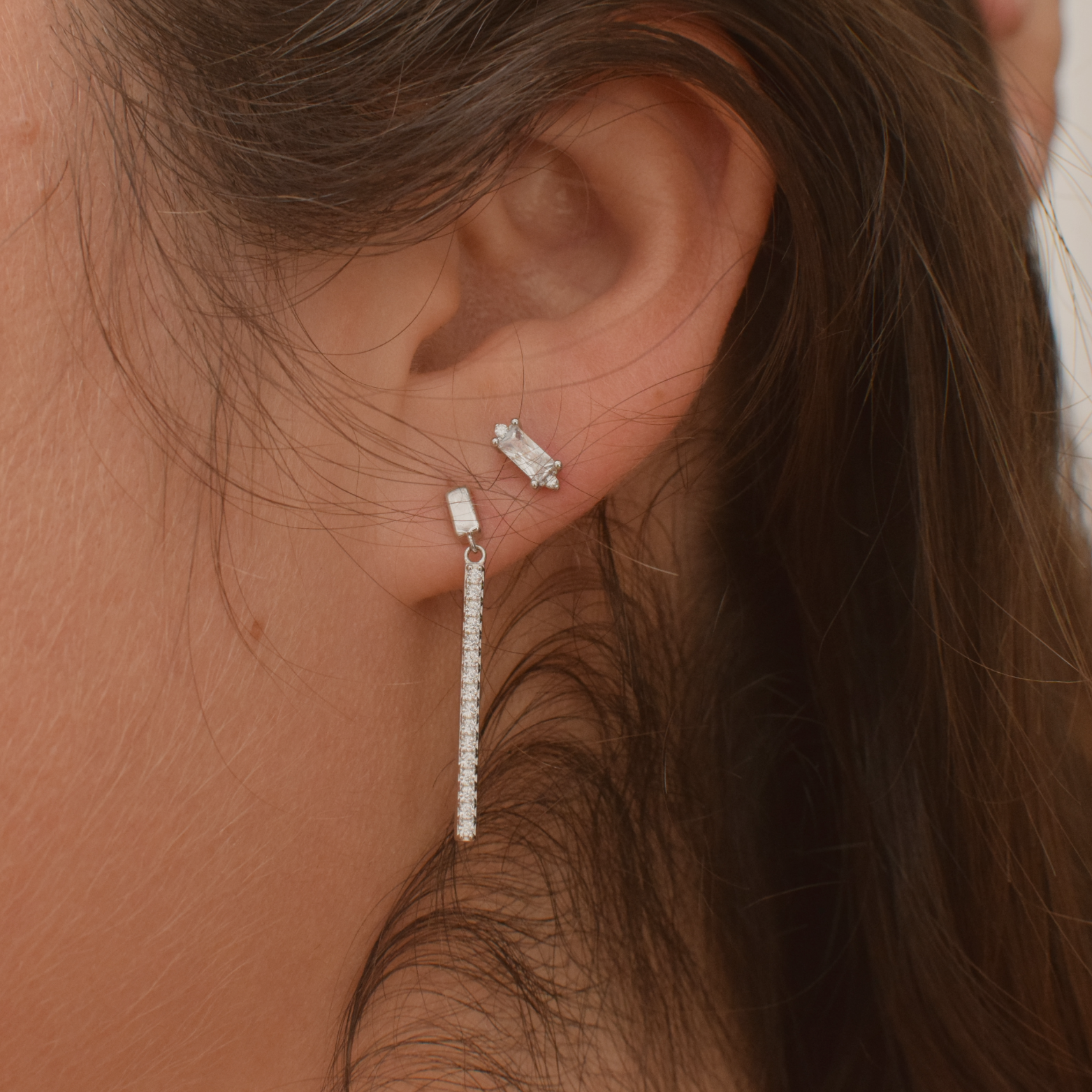 Close-up of a woman wearing Teesha sterling silver studs