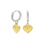 Model wearing two-tone heart hoop earrings