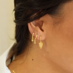 Close-up of a woman adorned with the Aurora Hoops 14K Gold Plated earrings