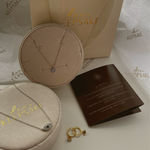 Zephyr 14K gold-plated necklace elegantly presented on a display table